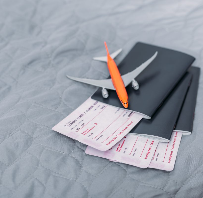 composition of flight tickets with toy airplane